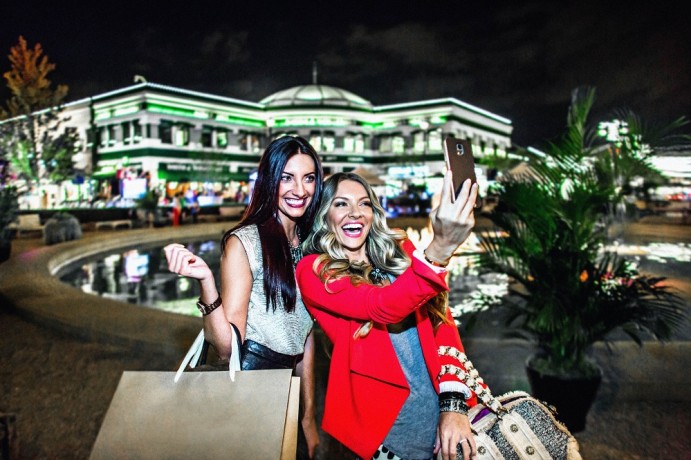 Two women smiling and taking a selfie