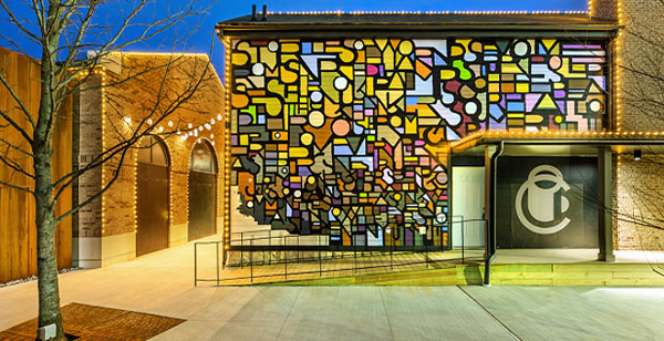 Stained glass-style outdoor wall mural.