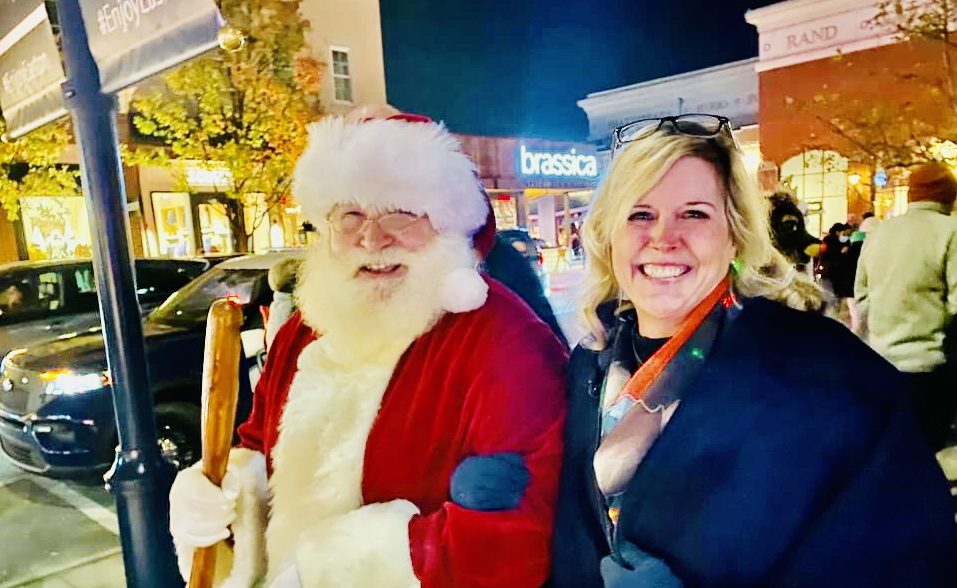 Jen Peterson smiling with Santa