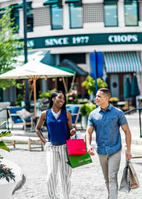 Couple walking through shopping center