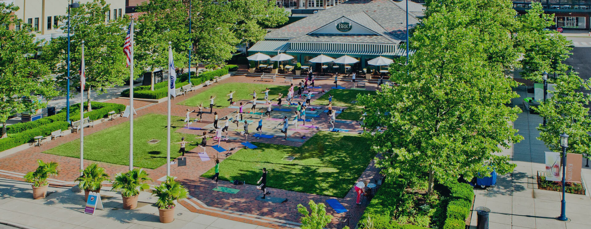 Overhead view of yoga on the lawn in front of Brio restaurant